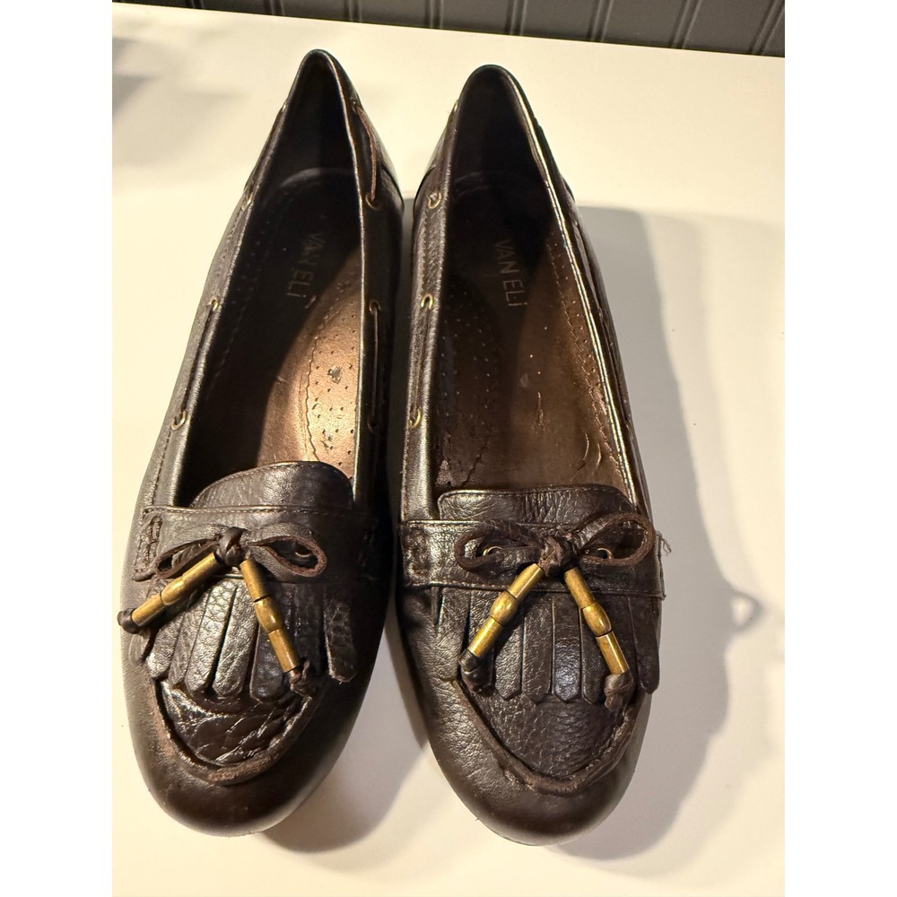 dark brown leather Van Eli slip-on loafers featuring a fringed kiltie tongue
